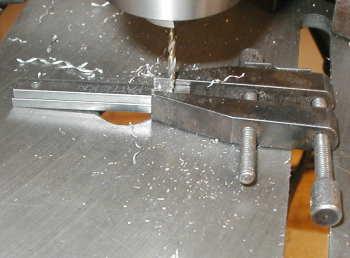 The first step was to drill the holes in 1/8" X 1/4" bar stock as shown on the left.