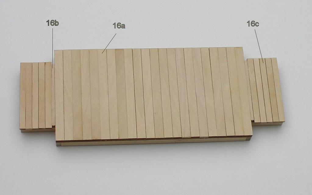 Weight this on a flat surface to insure that there is no warping of the frame. (See photo 1 and 2) Photo 1 Photo 2 2.) Turn the frame over and add the planking as shown in (Photo 3).