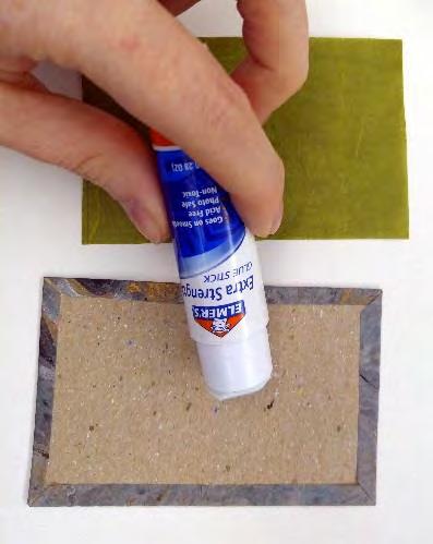 3. Using the glue stick, apply a thin coat of glue to the paper