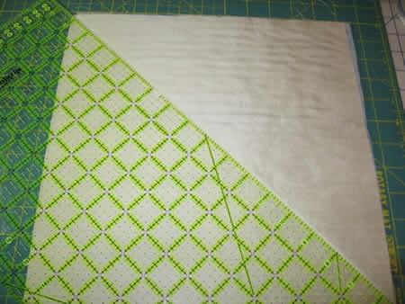 1. Fuse the Quilt Magic to the wrong side of the 12" (30.5cm x 30.5cm) cream silk square. 2.