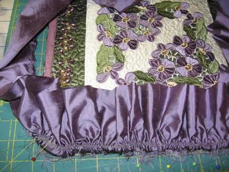 Fold the lavender silk in half lengthwise, wrong sides together, and press.