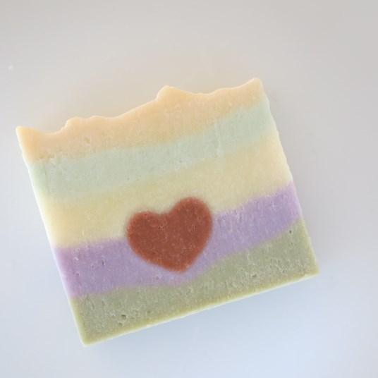 White and black handmade soap is strikingly swirled together using the hanger swirl technique and the top is dusted with organic Rose petals. Vegetarian with shea butter. Rainbow Heart New!! $4.