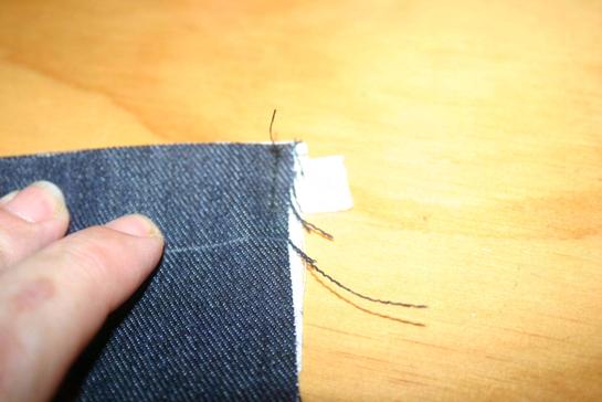 8. With a piece of marking chalk, mark down 2cm from the top of the pocket. 9.