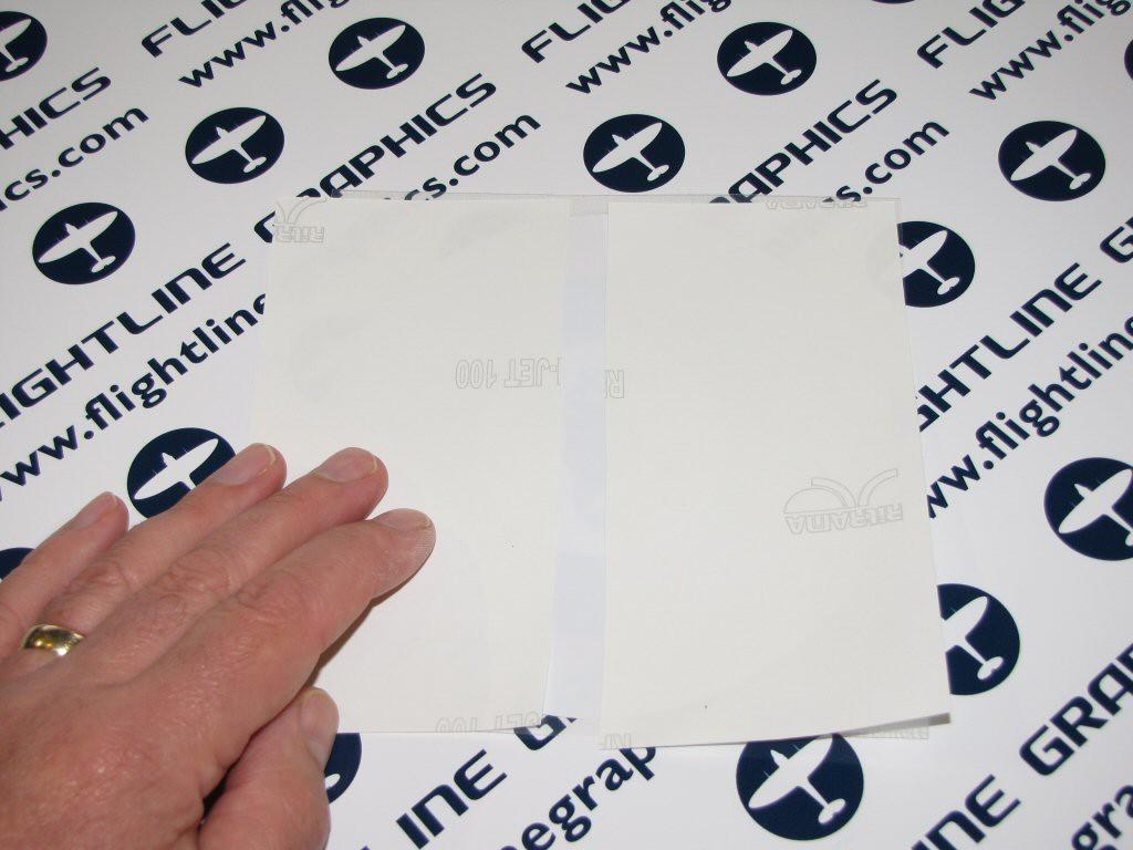 return the 2 pieces of silicone paper to the back of the decal. Be sure to apply the silicone face to the decal!