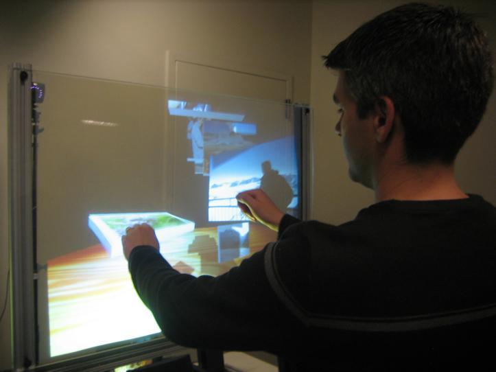 1. Introduction Most of the interactive touch-sensitive surface systems restrict the user interaction to a 2D plane of the surface and actively disregard the interactions that happen above it.