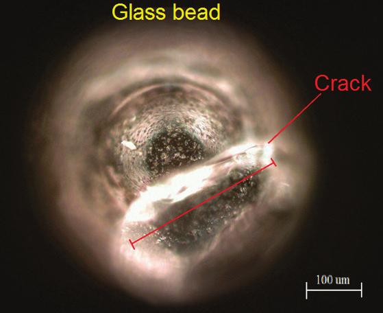 Applying 1 and more laser pulses, reduces remaining cracks in the beads, probably, due to increased temperature of glass which makes glass ductile close to fusion area.
