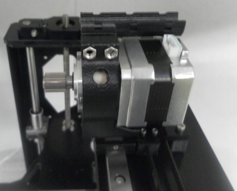 Attach Extruder Motor to Printed Extruder Motor Mount 2- M4 X 35 SS Socket 2 M4 SS Washer 2 M4 Nut 1 Extruder Motor Insert M4 Nuts into the hex holes on the Printed Extruder Motor Mount.