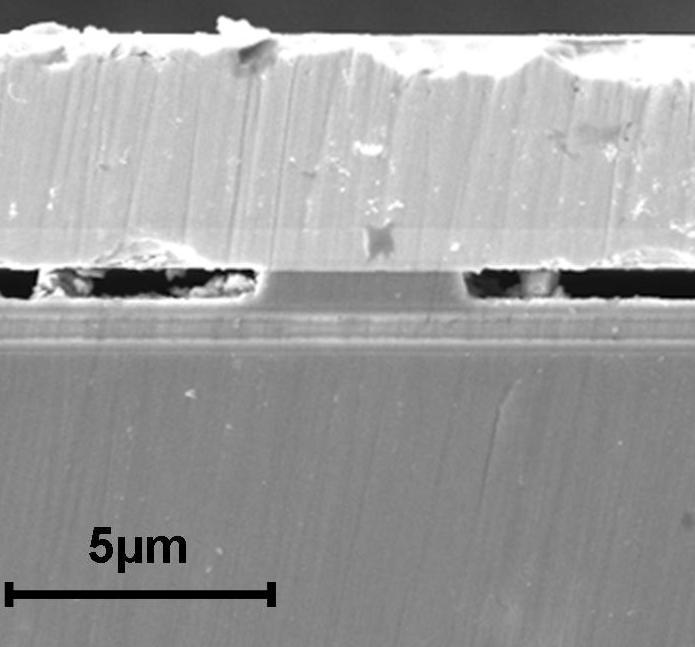 The final device length after dicing and polishing is 8 µm. An image of an 8x8 mm 2 bonded sample after InP substrate removal is shown in Fig. 4a.