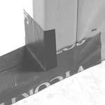 Cut barrier tape the thickness of the wall and 12" longer than the width of the opening. Extend the edge of the tape 1" past the exterior wall surface (FIGURE 2B).