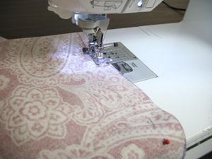 Sew a 1/2 inch seam along the sides of the fabric only.