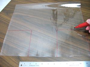 Finally, we will prepare the four side pockets. Cut four pieces of the clear vinyl 16 inches wide by 14 inches high.