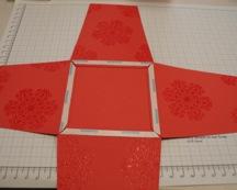 Flip over the assembled base and apply double-sided tape all around the edges as shown right and adhere the second