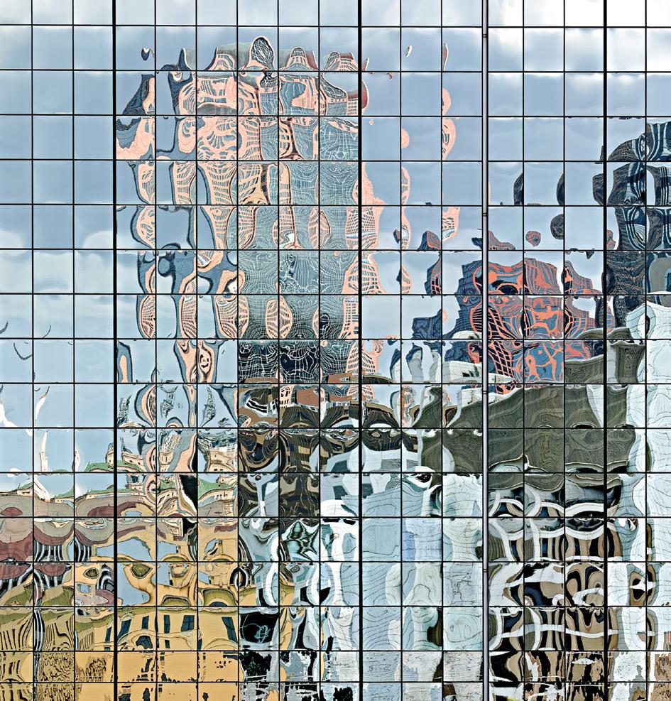 In the Land of Dali dallas, tx Andrea has made a study of cityscapes reflected in distorted patterns in window glasses.