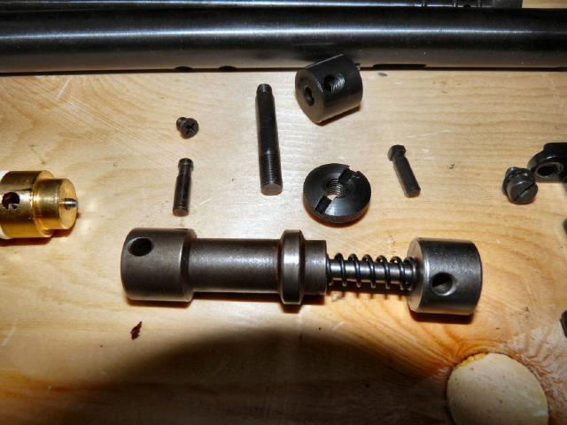 NOW THE HAMMER, HAMMER SPRING AND COCKING BLOCK SHOULD SLIDE FROM THE BACK OF THE MAINTUBE, NEXT REMOVE THE STUD FROM WHICH THE STOCK NUT ATTACHES, IT SHOULD JUST UNSCREW THEN THE STOP BLOCK (TOP OF