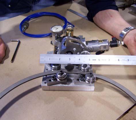 Once adjusted, the motor is initiated using the paddle trigger. The ring is then indexed, passing the welded section and cutting the groove in alignment with the balance of the groove.