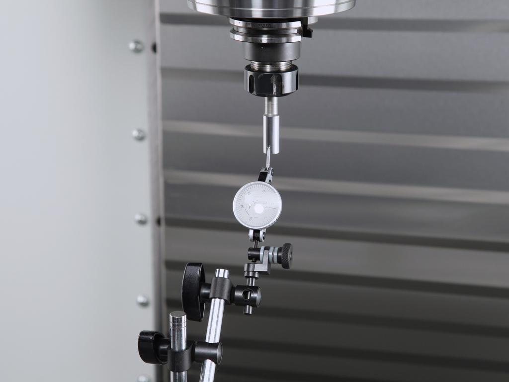 With the Indicator mounted on the table, measure the runout of the Calibration Bar gauge pin. If runout exceeds 0.