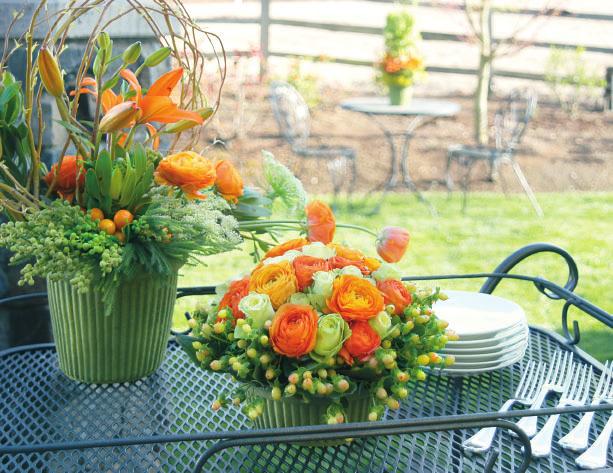Textural components make for added visual interest. Hypericum berries with their smooth, glossy finish contrast beautifully with melon colored ranunculus and fresh green roses.