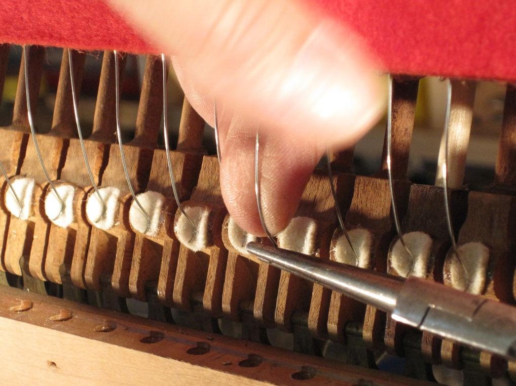 Hammer butt (or hammer rail) springs perform an essential function in the action of the vertical piano. Each time a note is played, the hammer must swiftly return to the rest position.