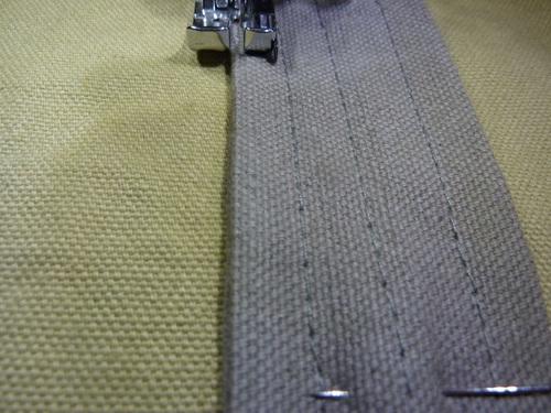 Stitch from the bottom raw edge up to the where the strap disappears under the horizontal panel. Do not stitch onto the horizontal panel. Leave the inner edges un-stitched.
