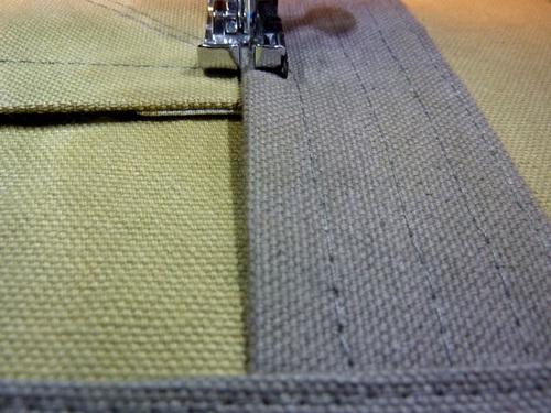 This secures the remaining side of each strap as well as both pockets. As above, do not stitch up onto the horizontal panels.