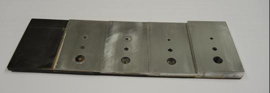 Figure 3. Calibration sample A with stepped wedge aluminium plate glued to carbon fibre. The aluminium plate has 4, 6 and 12 mm diameter holes to simulate disbonds of the outer side joint. Figure 4.