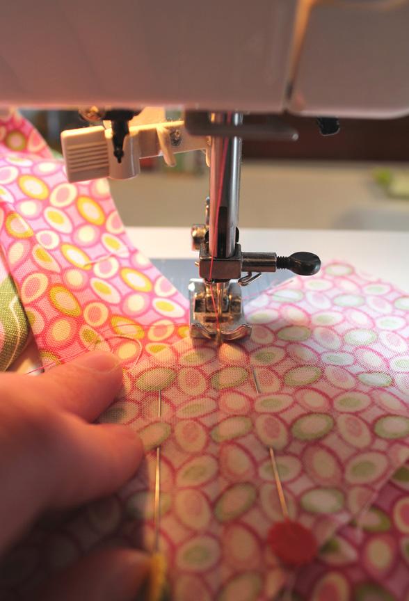 Pick up the unsewn section of the binding and trim off the excess fabric, leaving ¼ seam allowance.