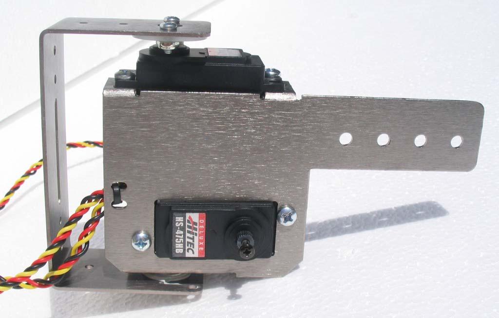 9. Using (2) #6-3/8 screws, lock washers and nuts, install the vertical, leg lift servo to