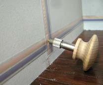 If you pound with a hammer, back up the wall with a weight to absorb the impact so the glue joints won t be stressed.