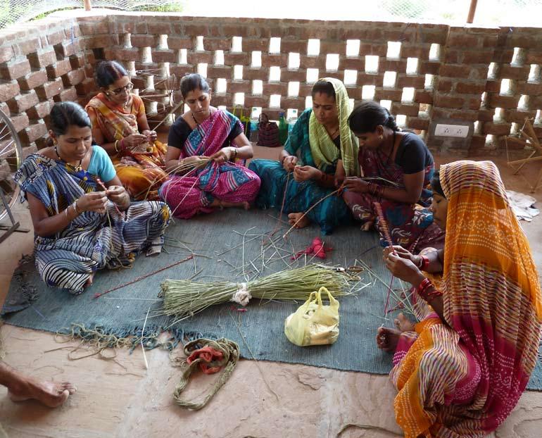Training the women in material preparation The ladies were trained in bunching up vetiver and wrapping