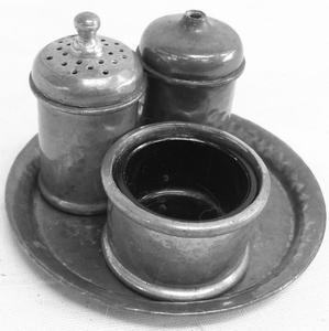 A Vintage Pewter Cruet Set. Salt Pepper and mustard complete with blue glass intact all set on a small tray.