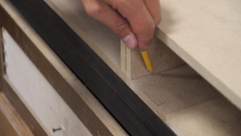 Then use a drill to drill three (3) holes per support wing on the surface of the table.
