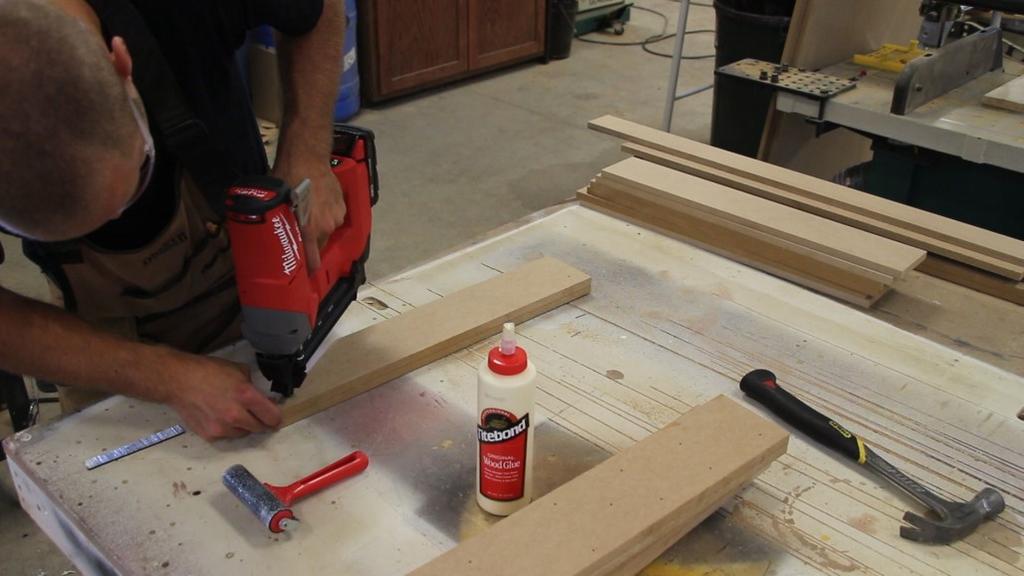 A little glue goes along way. As you place the second vertical support on top, rub them back and forth. This is called rubbing the joint as it promotes solid adhesion and gets any air out.