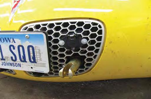 Hold fascia as close to its original position as possible and cut a hole in the grille with a hack saw blade