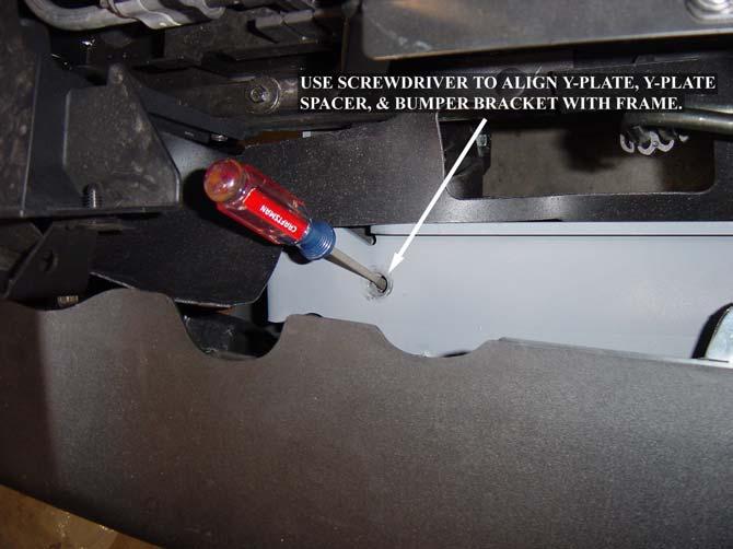 7. Set the Y-Plate Spacers on the bumper brackets as shown in Figure 6a. Slide the bumper into place. The bumper bracket and Spacer slide underneath the Y-Plate.