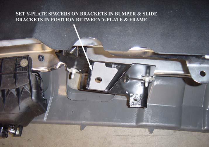 Figure 6a: Place Y-Plate Spacer on bumper. NOTE: WHEN ALIGNING THE HOLES IT IS CONSIDERABLY EASIER IF THE Y-PLATE ONLY HAS ONE BOLT PER SIDE HOLDING IT IN PLACE, AND IF THE BOLTS ARE LOOSE.