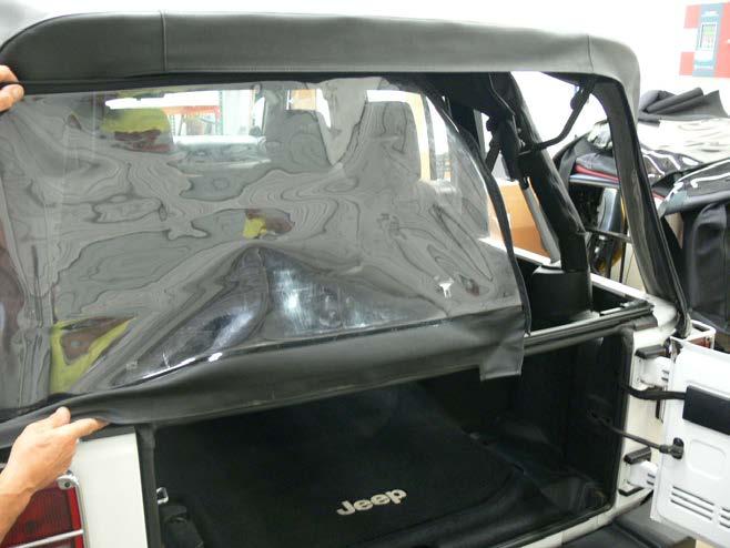 Slide out the lower support rail from the rear window to reuse in replacmenet Top.