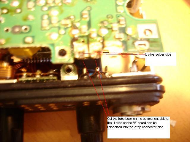 34. Re-install the RF board back in the radio casing by placing the VCO end in first then press the U-clips down so they make contact with the 2 top connector pins.