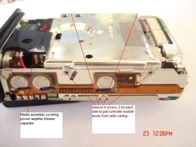 4. To remove the controller module (this is the large metal module in the center of the radio) first remove the 4 side screws.