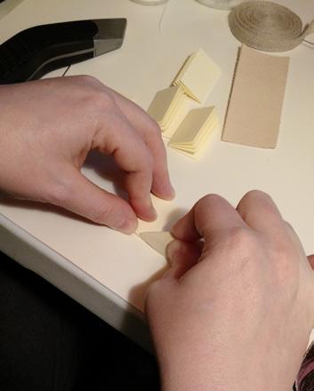 use a bone folder to set the crease in the pages.