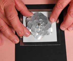 Do this before you layer the flower shapes onto the brad. Build the card.