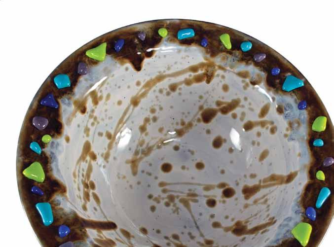 This square dish has a free form engraving art pattern on the entire interior. After glazing and firing, dichroic glass and a coating of clear frit were added in the bottom and fired to full fuse.