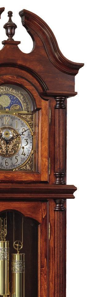 #2000 Pequea Grandfather Floor Clock Features Swan neck top with finial Reeded columns with turned ends Embossed egg and dart moulding below bottom door Beveled glass on