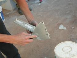 ) Using a 10mm notched trowel, apply the adhesive across the moulding.
