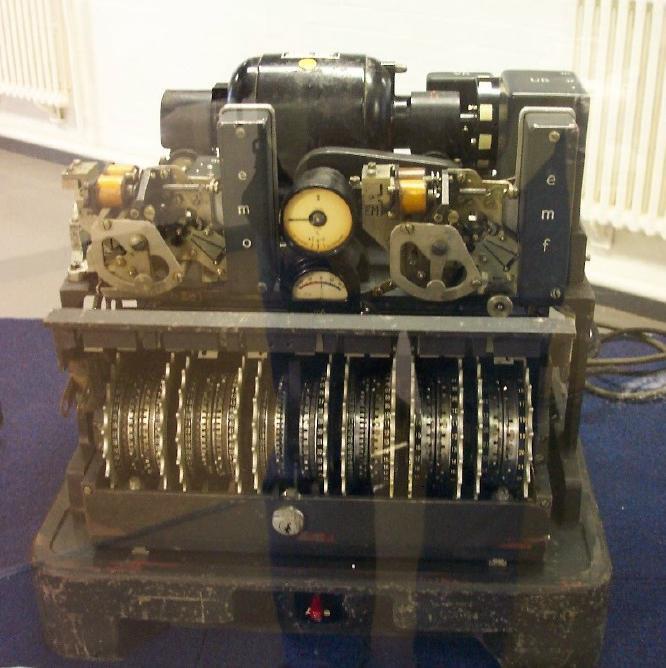 A 12-rotor cipher machine, origin unknown. A U.S. Army M-209 cipher machine.