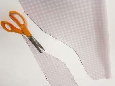 Cut through both layers of fabric along the curved line.