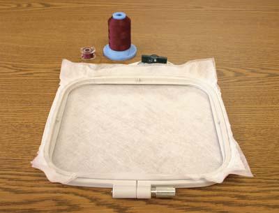 Hoop 2 layers of water soluble stabilizer and prepare embroidery machine to sew