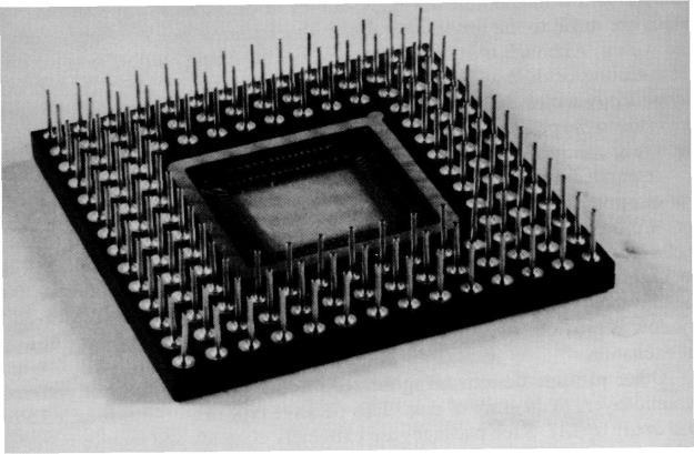 types. The TH types include the dual in line package (DIP) shown in Figure 11.10 and the pin grid array (PGA) package displayed in Figure 11.11. Both are available in hermetic ceramic and plastic types.