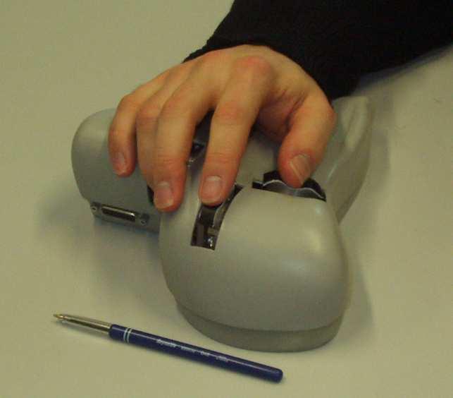 The DigiHaptic with its three levers actuated by motors and the way the user puts his hand on it. In each mode there is a relationship between finger and object movement.