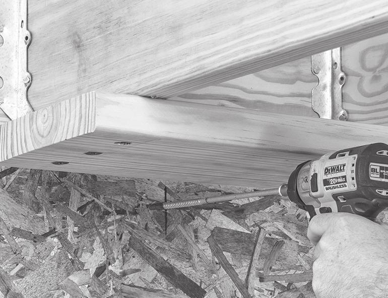Install a piece of 2x8 blocking to the underside of the two joists where the stud falls