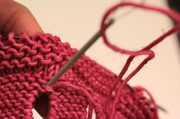 Knit in garter stitch until piece measures (without stretching) the same as the brim of the hat. BO all sts.